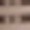 A blurred close-up image featuring horizontal beige and brown stripes in soft focus.