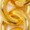 A close-up of golden brown onion rings, highlighting their crispy, fried texture and savory appeal.