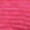 Close-up of a pink textured fabric featuring horizontal wavy lines, highlighting the intricate textile pattern.