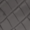 Close-up of a dark rubber tire tread pattern featuring diagonal grooves for superior grip.
