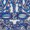 A close-up of an ornate blue and silver masquerade mask with intricate patterns, shimmering accents, and cutout details around the eyes and face.