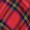 Red and black tartan plaid fabric pattern with diagonal lines forming squares, intersected by bands of green, yellow, and white for a classic textile design.