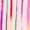 Vertical lines in various shades of pink, red, blue, and white are arranged in a harmonious composition.