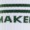 Blurry partial text in green capital letters reads MAKER below two horizontal lines, creating a modern, abstract effect.