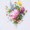A colorful bouquet of assorted flowers, featuring vibrant pink, purple, yellow, and blue blooms in a delightful arrangement.