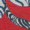 Close-up of a bold, modern abstract pattern featuring red, white, and black curved shapes.