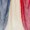 Close-up of fabric with three vertical stripes in blue, white, and red, highlighting its vibrant textile texture.
