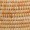 Close-up of brown woven rattan or wicker texture featuring a repeating horizontal and vertical pattern, showcasing craftsmanship and natural materials.
