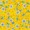 A close-up of a yellow surface featuring a pattern of scattered small white flowers and green leaves, creating a fresh, botanical design.