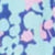 Blurry abstract pattern featuring light blue, lavender, and pink shapes on a blue background.