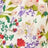 Close-up of a fabric with a colorful floral print featuring red, pink, and purple flowers with green leaves on light fabric.