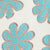 Simple blue flowers with orange outlines repeat in a fresh, seamless pattern.