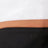A close-up image showing three horizontal bands: white on top, a thin tan line in the middle, and black on the bottom, highlighting minimalistic contrast.