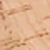 Close-up of a light brown wooden surface with visible grain patterns, natural texture, and subtle markings.