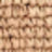 Close-up of a woven beige or light brown textured material, possibly fabric or a basket, showing a repeating pattern of interlaced strands.
