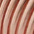 Close-up of multiple copper wires wound parallel to each other, featuring metallic strands with reddish-brown and shiny beige hues, highlighting the intricate texture of electrical wiring.