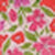 A blurred image of a floral pattern featuring pink and red flowers with green leaves, creating a soft, dreamy effect.