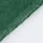Close-up of a green textured surface merging with a smooth white area, separated by an uneven edge.