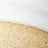 Close-up of a textured surface featuring a diagonal division between a white section at the top and a gold, glittery area below, showcasing striking contrast and detail.