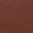 A close-up view of a flat, reddish-brown surface with a slightly rough, earthy texture.