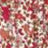 A close-up of a red, pink, and white abstract pattern with a speckled appearance, featuring soft blurred colors.