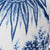 Blue and white floral pattern featuring intricate leaf and flower designs on fabric, creating an elegant botanical look.