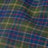 Close-up of a vibrant fabric featuring a blue, green, red, and yellow plaid pattern with colorful textures.