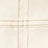 Close-up of beige fabric with intersecting brown stitching forming a cross pattern.