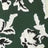 White and black floral patterns on deep green create a striking contrast.
