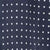 Close-up of fabric featuring a regular pattern of small white polka dots on deep navy blue.