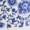 Blue and white floral pattern featuring intricate, stylized flower and leaf designs with graceful botanical details.