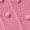 Close-up of a textured pink surface featuring diagonal lines and raised dots, creating a tactile pattern.