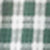 A blurred image displays a green and white checkered or plaid pattern, with specific details not distinguishable due to the lack of focus.