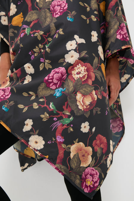 Black Floral Barbour x Tuckernuck Poncho features a bold botanical print with birds, offering an effortless, high-end look. Classic and fun, perfect for rainy days.