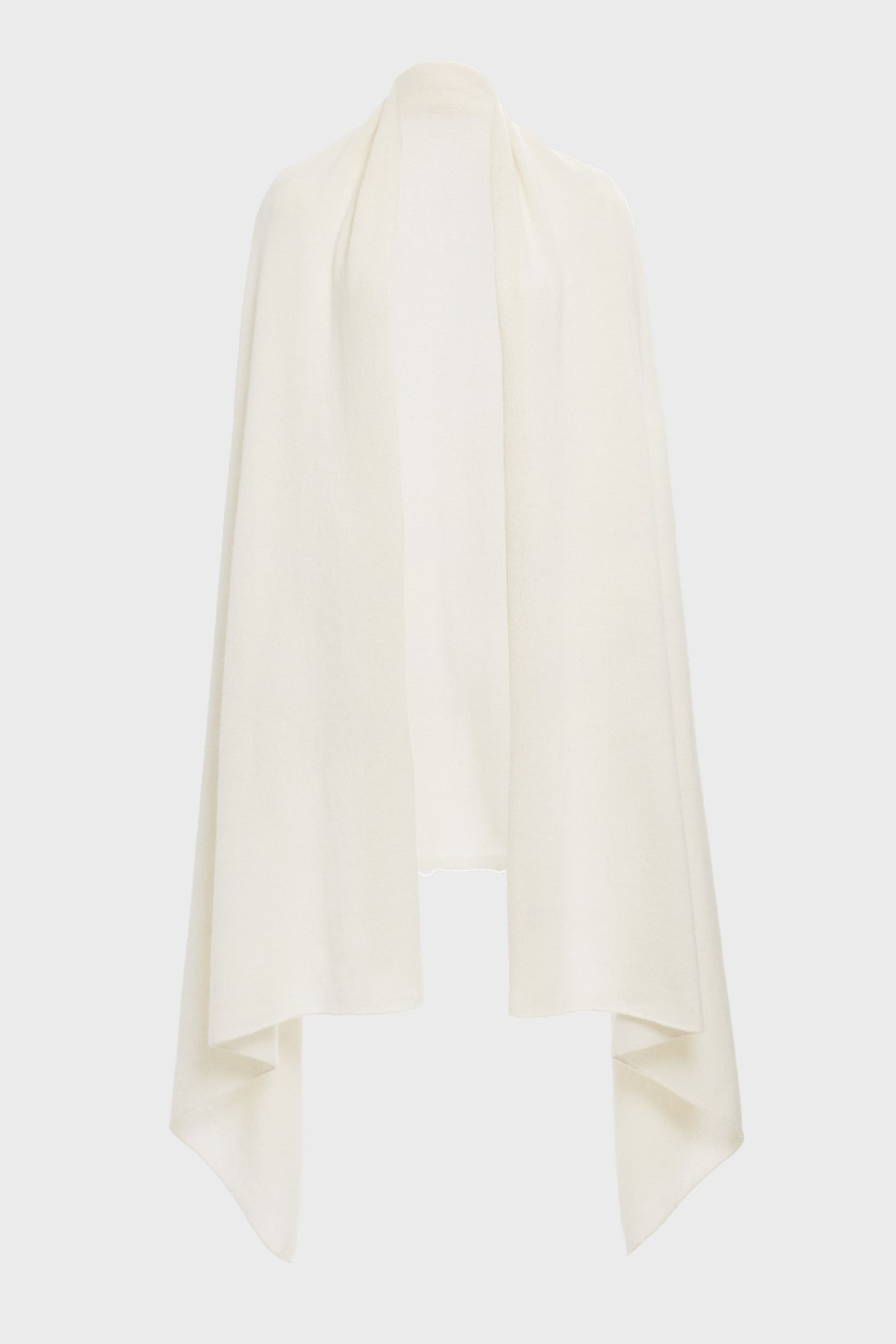 A Tuckernuck ivory cashmere blanket scarf, cream-colored with draped sides, is shown open-front against a white background.