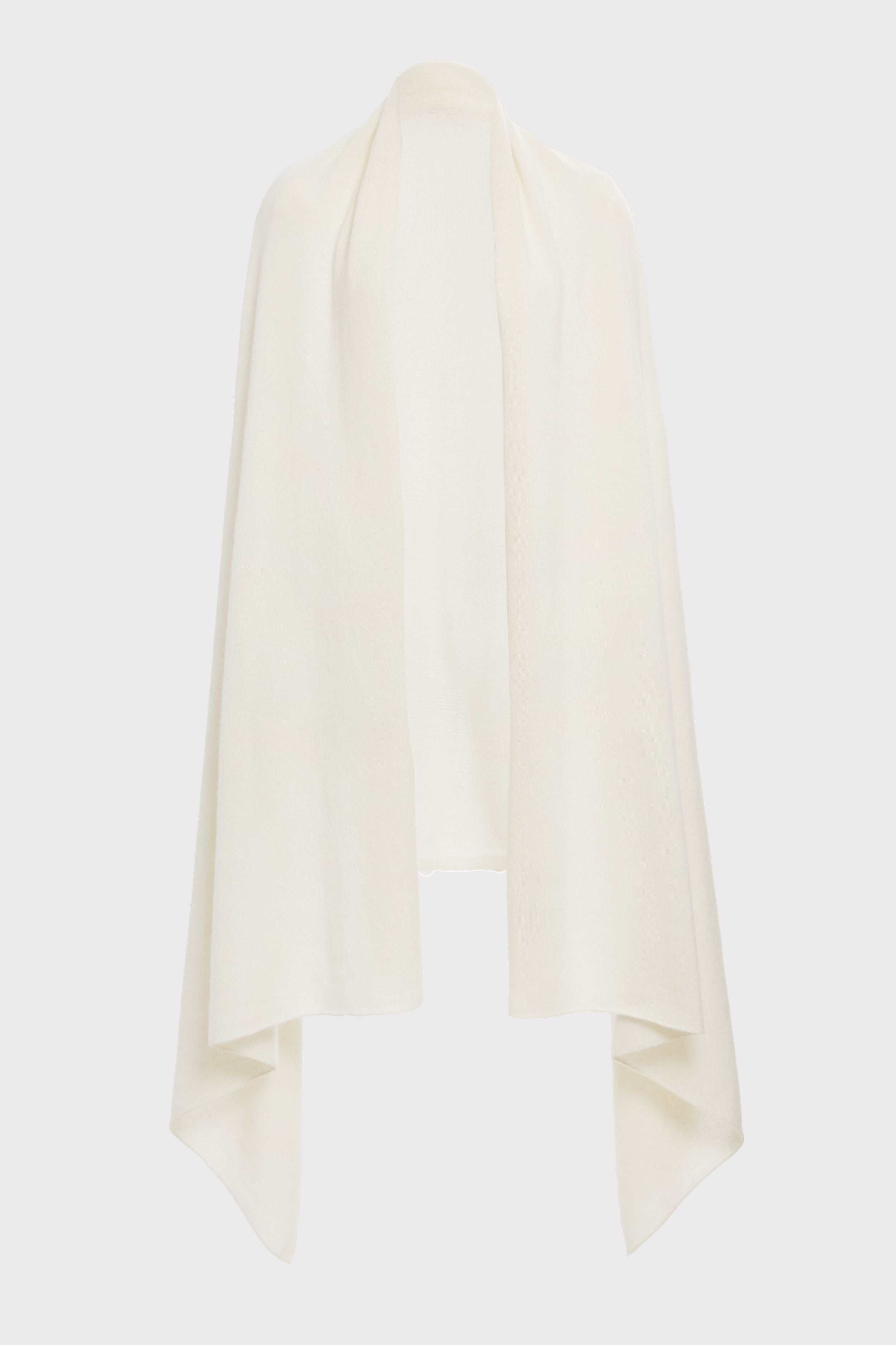 A Tuckernuck ivory cashmere blanket scarf, cream-colored with draped sides, is shown open-front against a white background.