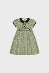 Bottle Green Floral Portia Girl Dress with Peter Pan collar, bows, and floral print offers a classic, effortless, and fun fit-and-flare silhouette. High-end design for versatile wear.