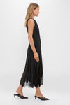 Model in Black Mixed-Media Coco Maxi Dress, featuring an effortless tunic-style bodice and classic lace-paneled skirt, embodying Tuckernuck's fun and high-end fashion ethos.
