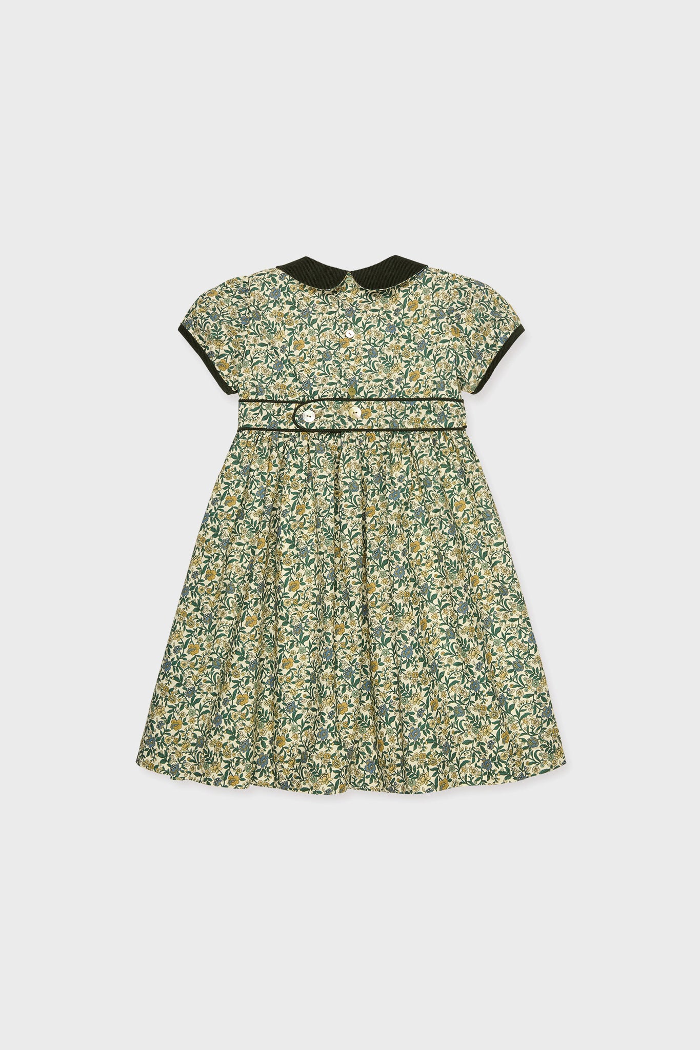 La Coqueta Portia Girl Dress: This short-sleeve floral dress for children features a dark Peter Pan collar and matching waistband, showcasing exquisite Spanish craftsmanship, displayed flat on a white background.