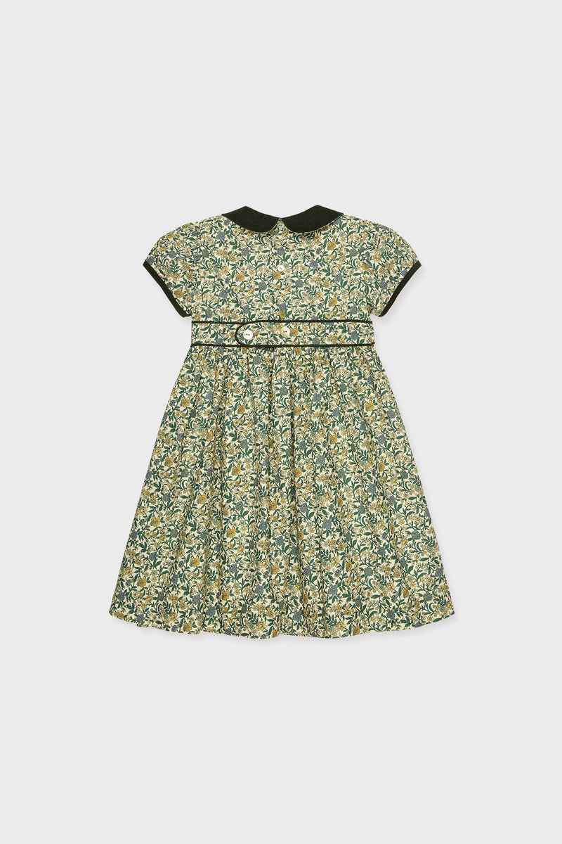 La Coqueta Portia Girl Dress: This short-sleeve floral dress for children features a dark Peter Pan collar and matching waistband, showcasing exquisite Spanish craftsmanship, displayed flat on a white background.