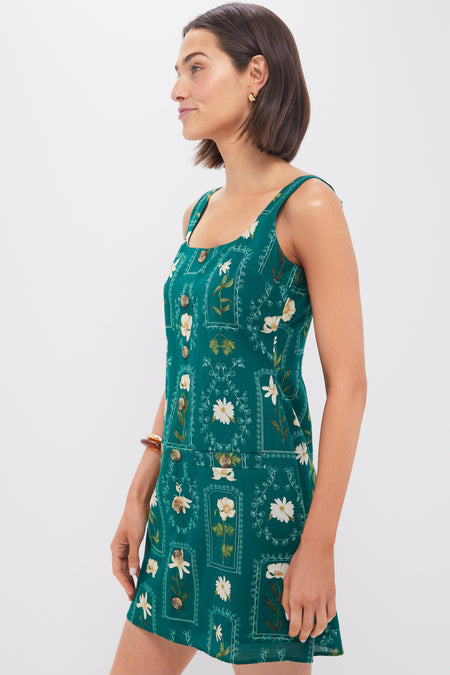 Woman in classic Teal Stem Merrit Mini Dress with floral motifs and square neckline, evoking effortless, high-end style.