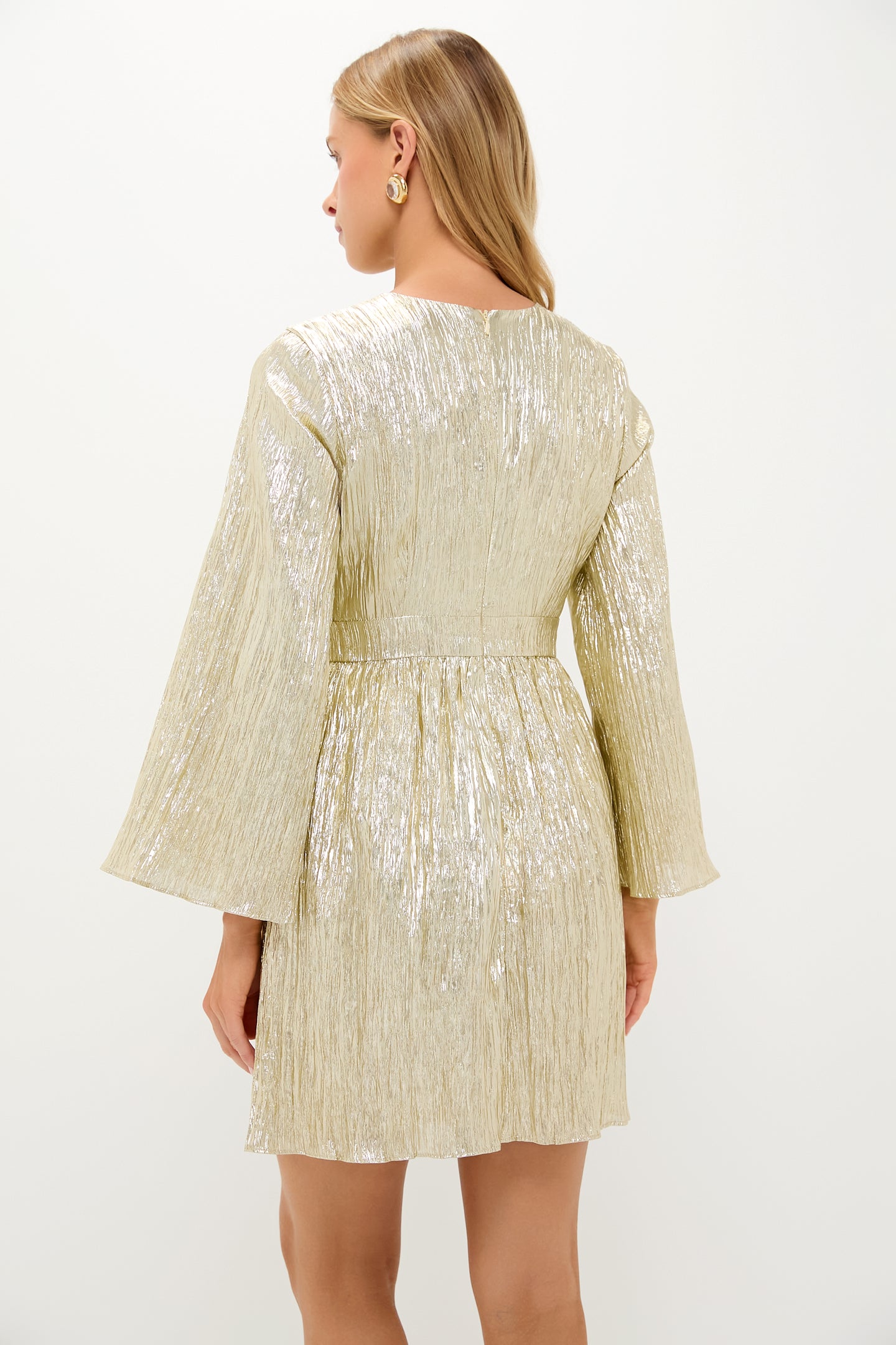Gold Plisse Carol Bow Mini Dress: Classic, high-end style with an effortless, fun twist, featuring long bell sleeves, a defined waistband, and a flattering A-line silhouette.