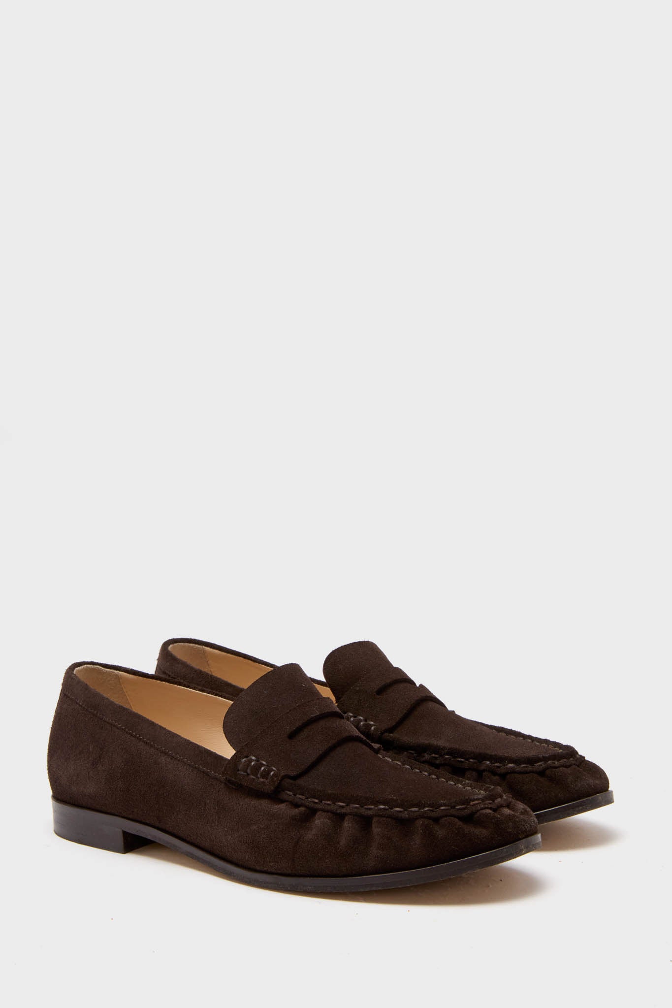 Classic Chocolate Suede Vivian Loafers, effortlessly high-end and fun, feature a penny loafer silhouette. Ideal for versatile styling, crafted in Portugal for chic, confident wear.