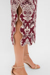 Blush Pink and Burgundy Bicolor Jacquard Waves Midi Skirt with ornate damask embroidery and scalloped-edge side slit, styled with nude ankle-strap sandals for an effortless, classic look.