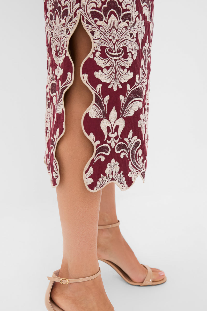 Blush Pink and Burgundy Bicolor Jacquard Waves Midi Skirt with ornate damask embroidery and scalloped-edge side slit, styled with nude ankle-strap sandals for an effortless, classic look.