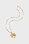 Jane Win Gold Forever Original Pendant: a 14k gold plated necklace with a round pendant featuring engraved flower, sword, and key motifs, inspired by classic compass coin designs.