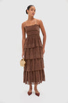 Model in Sepia Lace Leina Midi Dress with classic tiered velvet lace, holding a tan handbag; effortless, high-end look with fun, adjustable straps and fitted bodice.