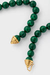 Malachite Double Strand Celine Necklace featuring classic, dangling green-and-black beads with gold-tone spiral caps for an effortless, high-end look. Perfect for adding fun sophistication.