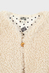 Cream Teddy Vest with curly fleece, a classic single-button closure, and fun star-patterned lining, embodies effortless, high-end style for your child's wardrobe.