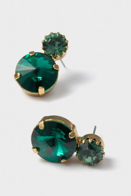 Emerald Myrla Earrings feature classic, effortless elegance with emerald-green stones in gold-tone prong settings, epitomizing high-end fun for any sophisticated occasion.